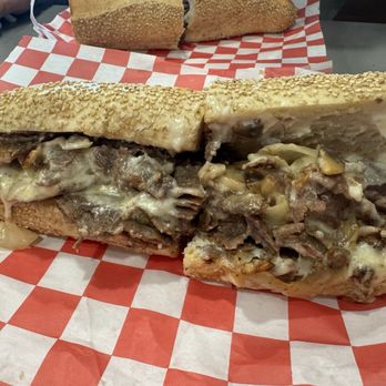 Amici Pizza & Restaurant - Million $ cheesesteak made with shaved ribeye, caramelizes onion and cooper cheese on a sesame roll. - Pizza Near Me - Mechanicsburg, Pennsylvania Amici Pizza & Restaurant - Million $ cheesesteak made with shaved ribeye, caramelizes onion and cooper cheese on a sesame roll. - Pizza Near Me - Mechanicsburg, Pennsylvania