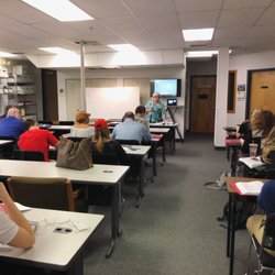 Mulroy School of Real Estate - Instructor Cynthia speaking while her students take notes