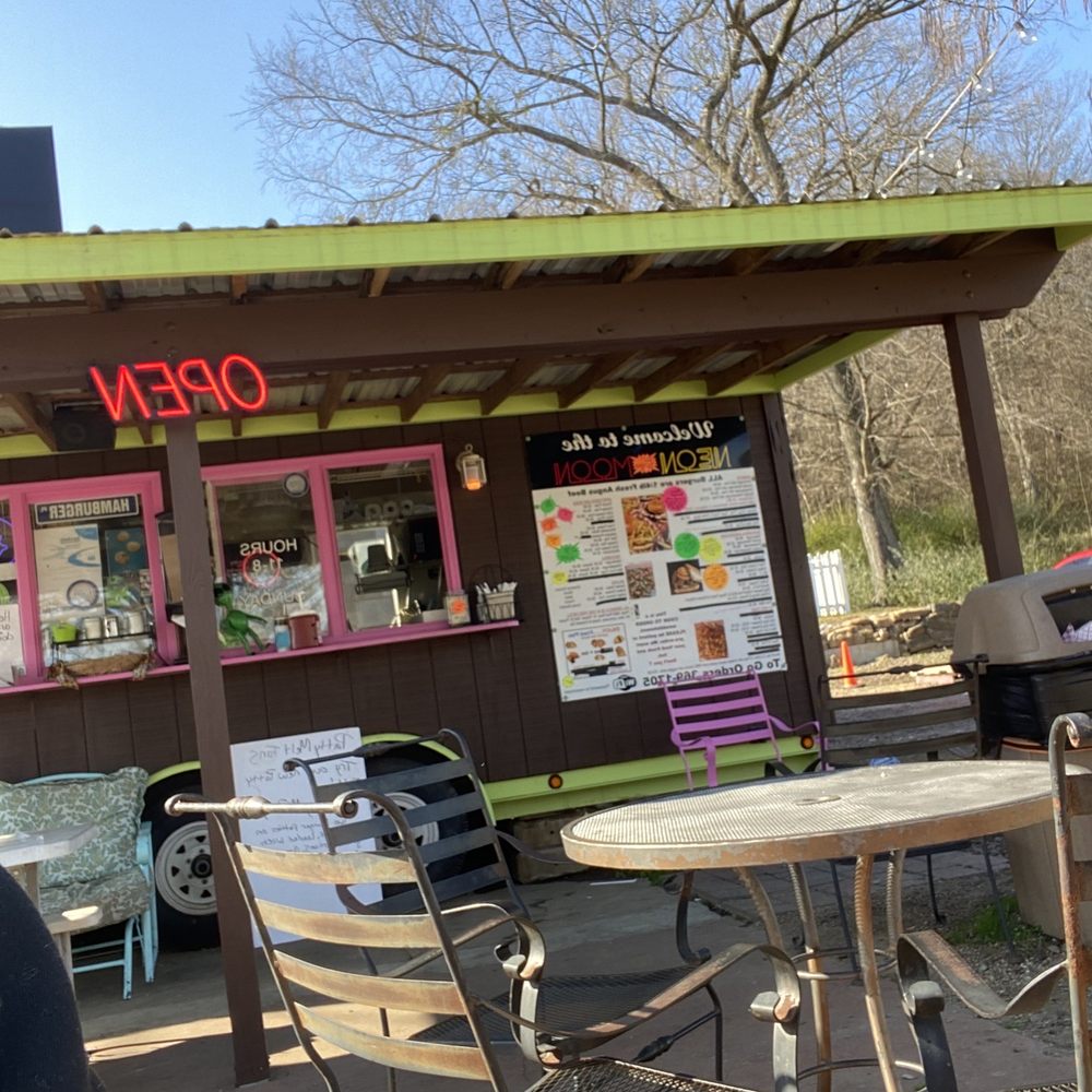 Neon Moon - the outside of a restaurant with tables and chairs - Burgers Near Me - Mountainburg, Arkansas