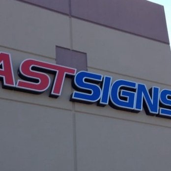 Fast Signs - Store front - Exterior view of a building with a sign reading 'FAST SIGNS' in red and blue letters, indicating a signage business. - Printing Services Near Me - Mesa, Arizona