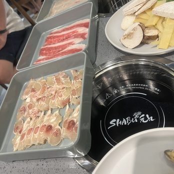 Shabu En - Look at the chicken slices. As thin as a paper. Beef tendons shrank as soon as we put it in the pot. - Hot Pot Near Me - Houston, Texas Shabu En - Look at the chicken slices. As thin as a paper. Beef tendons shrank as soon as we put it in the pot. - Hot Pot Near Me - Houston, Texas