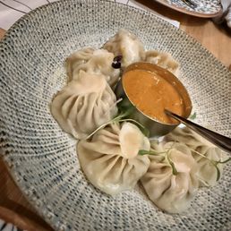 Steamed chicken momo sauce on the side Steamed chicken momo sauce on the side
