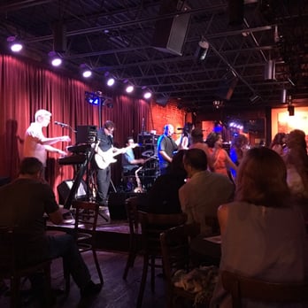 The Levee - a band performing in a dimly lit room - Bars Near Me - Kansas City, Missouri The Levee - a band performing in a dimly lit room - Bars Near Me - Kansas City, Missouri