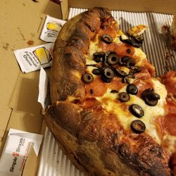 JUST RECEIVED MY PIZZA!!! ITS BURNT AND TASTE LIKE FREAKING CHARCOAL HOW THE HELL COULD YOU LET THIS LEAVE YOUR KITCH!