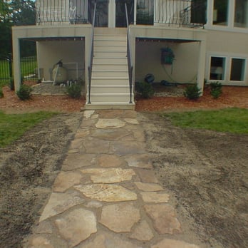 Debbie's Lawn Busters - after we installed the flagstone path to the pool, and added decorative gravel underneath the deck, - Landscaping Near Me - Cleveland, Missouri