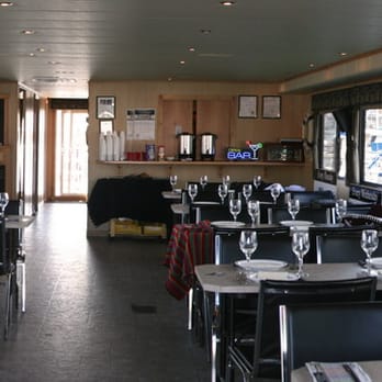 Executive Boardroom Dinner Cruises - Inside the Dining area that will hold up to 60 people , the most of any boat on the lake - American Near Me - Kelowna, British Columbia Executive Boardroom Dinner Cruises - Inside the Dining area that will hold up to 60 people , the most of any boat on the lake - American Near Me - Kelowna, British Columbia
