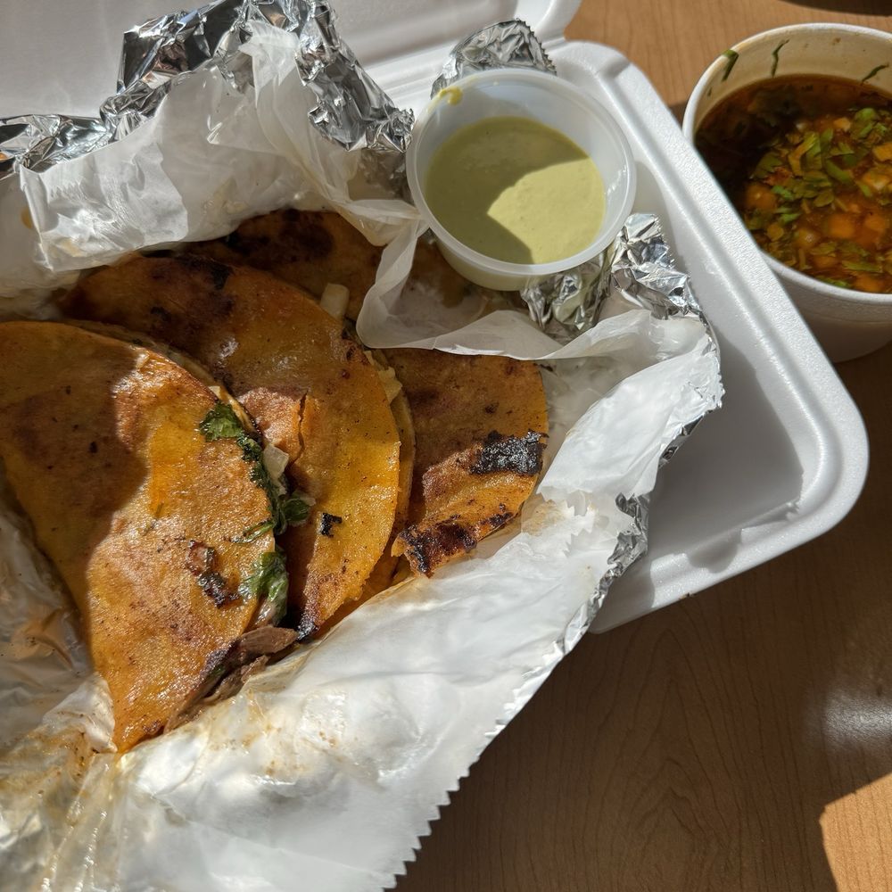 Quesabirria tacos with consommé, salsa verde and a side of chips and salsa Quesabirria tacos with consommé, salsa verde and a side of chips and salsa