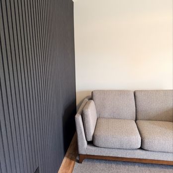 ESCO Home Improvements - Sofa and black accent wall. - General Contractors Near Me - Wappingers Falls, New York ESCO Home Improvements - Sofa and black accent wall. - General Contractors Near Me - Wappingers Falls, New York