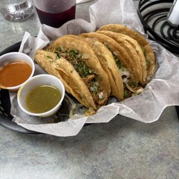 3 tacos de res(beef),  2 tacos de pollo(chicken)  literally walking by on rainy day  Food and sauces were amazing 10/10 on this visit