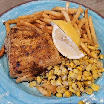 Simply Fish Seafood - Sea Bass done as Blackened Cajun with a side of Garlic Lemon Butter. Also sides of fries and corn. All great! - Fish & Chips Near Me - Costa Mesa, California