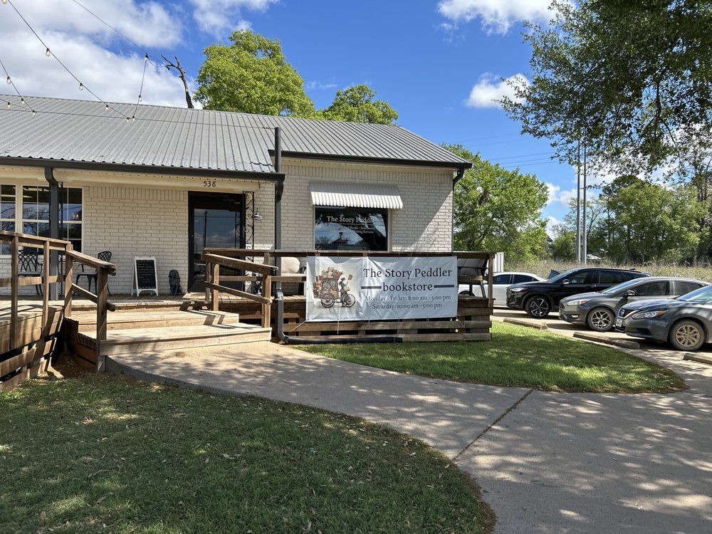 The Story Peddler Bookstore Logo