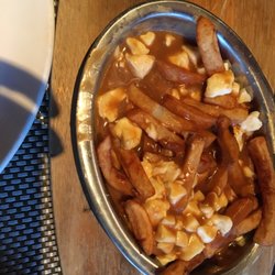Délice - Regular poutine- half eaten