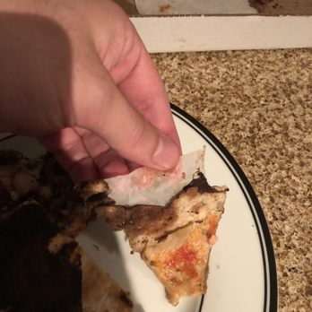 Pizza St-Viateur - a slice of pizza on a plate - Pizza Near Me - Montreal, Quebec Pizza St-Viateur - a slice of pizza on a plate - Pizza Near Me - Montreal, Quebec
