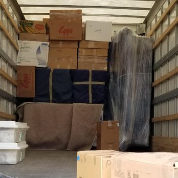 Memphis' Best Moving & Storage - Notice how the couch is wrapped to ensure total, water proof protection! - Movers Near Me Memphis' Best Moving & Storage - Notice how the couch is wrapped to ensure total, water proof protection! - Movers Near Me