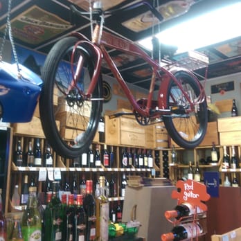 Spirits - a bicycle hanging from the ceiling in a liquor store - Beer, Wine & Spirits Near Me - Evans, Georgia