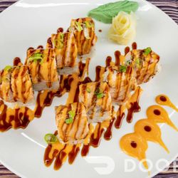 Kaki Japanese Cuisine - Nashville roll- crab salad, cucumber , avocado..
Top with seared salmon . Spicy Mayo, eel sauce, & green onion