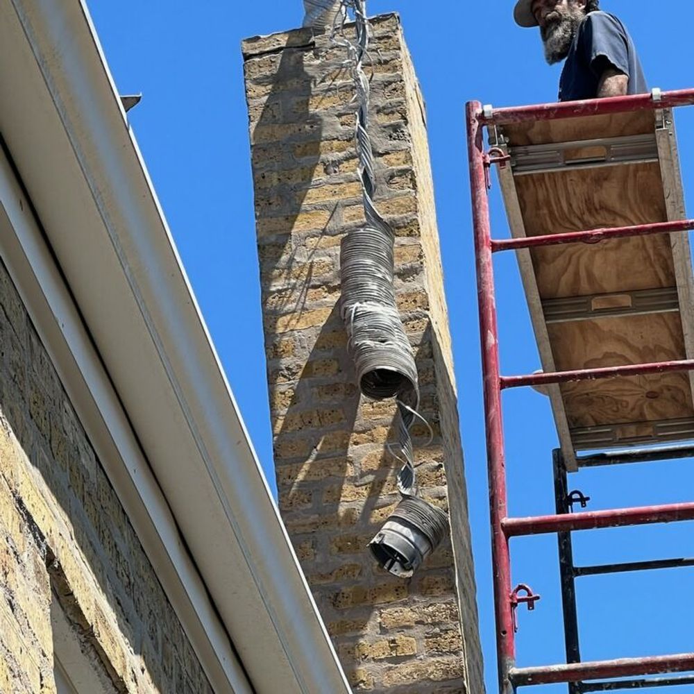 Chicago Chimney Service - Before chimney. There was two feet of unnecessary chimney added to the original chimney which they demolished. - Chimney Sweeps Near Me
