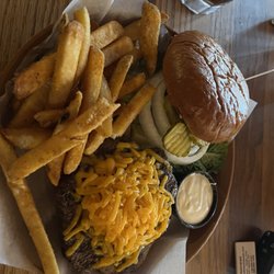 Proud Cut Saloon - 8 ounce Berger with cheddar cheese and steak fries.