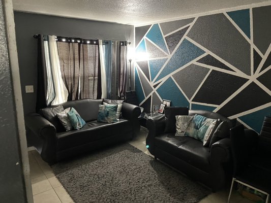 Move in process - This remodel was done in a living room it was in medium shape I painted the walls,mopped floors straighten up the furniture and place rugs and other furniture