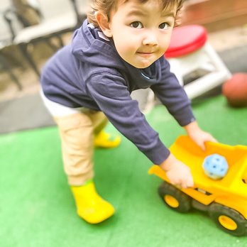 Tiny Bear's House - Toddler playing outdoors - Preschools Near Me - Briarwood, New York