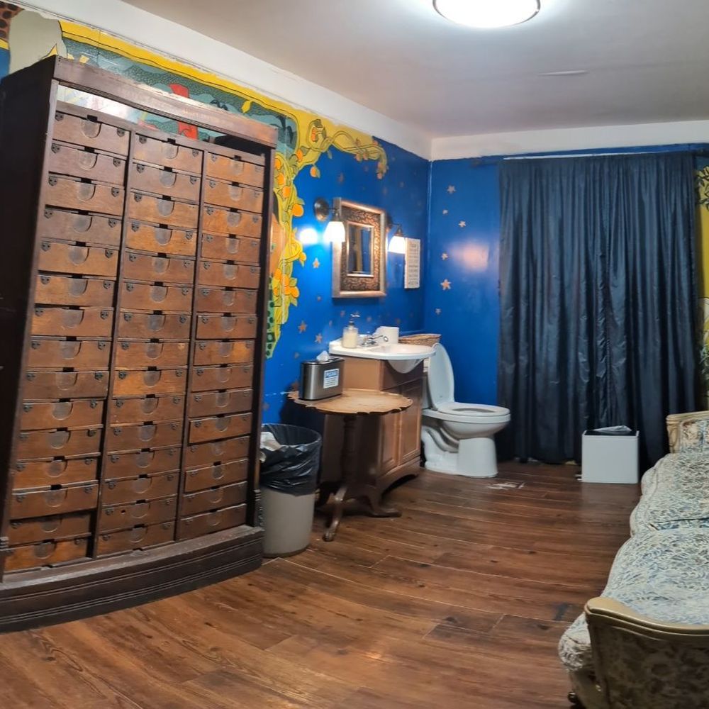 a bathroom with a wooden cabinet