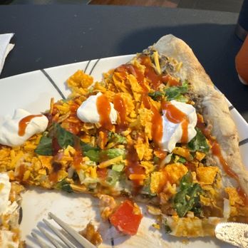 Mozza Pizza Restaurant - A slice that we added Doritos, taco sauce and sour cream to. - Pizza Near Me - Huntsville, Alabama Mozza Pizza Restaurant - A slice that we added Doritos, taco sauce and sour cream to. - Pizza Near Me - Huntsville, Alabama