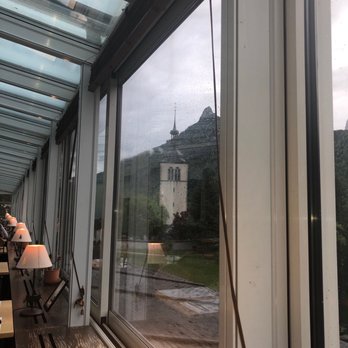 Restaurant le Saint Georges - View of the church from our table - French Near Me - Gruyères, FR