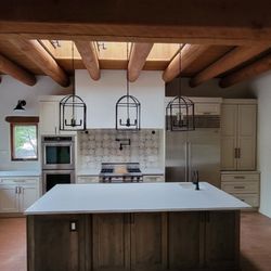 Design Alliance - Custom cabinetry with two tone finish. Complete kitchen remodel. Brick floors