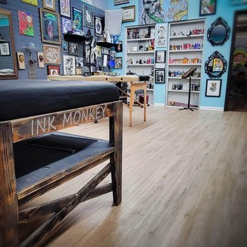 Ink Monkey Tattoo - The variety of ink colors on the back wall as well as the tattoo area - Tattoo Near Me - Macclenny, Florida
