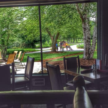 Zeke's Greenside Tavern - a view of a park through a window - American Near Me - Etowah, North Carolina Zeke's Greenside Tavern - a view of a park through a window - American Near Me - Etowah, North Carolina