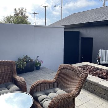 Pine Tree Design & Construction - New smooth stuccoed wall in white and modern 8' metal black gate for privacy. - General Contractors Near Me - Woodland Hills, California Pine Tree Design & Construction - New smooth stuccoed wall in white and modern 8' metal black gate for privacy. - General Contractors Near Me - Woodland Hills, California