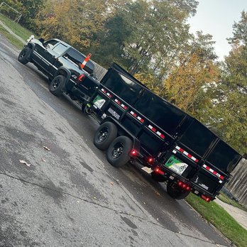 Salcido & Sons - two trucks parked in a parking lot - Lawn Services Near Me Salcido & Sons - two trucks parked in a parking lot - Lawn Services Near Me
