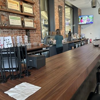 Fife Street Brewing - Courtney and the bar area pouring an awesome flight. - Brewpubs Near Me - Charleston, West Virginia