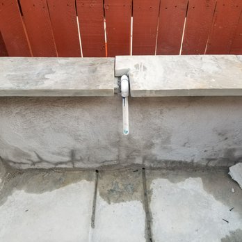 PMT Concrete - Notice their idea to cut the stone around a pipe. Horrible workmanship! - Masonry/Concrete Near Me - Sacramento, California PMT Concrete - Notice their idea to cut the stone around a pipe. Horrible workmanship! - Masonry/Concrete Near Me - Sacramento, California
