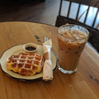 Slimak - Iced latte with Belgian waffle sprinkled with powdered sugar and a side of honey. - Coffee & Tea Near Me - Brooklyn, New York Slimak - Iced latte with Belgian waffle sprinkled with powdered sugar and a side of honey. - Coffee & Tea Near Me - Brooklyn, New York