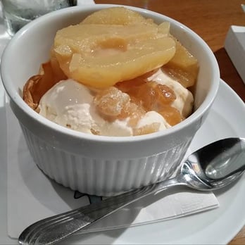 Aqua Restaurant - Poached pear flambé with crystallized ginger, salted caramel ice cream, puff pastry. - Seafood Near Me - Beaufort, North Carolina Aqua Restaurant - Poached pear flambé with crystallized ginger, salted caramel ice cream, puff pastry. - Seafood Near Me - Beaufort, North Carolina
