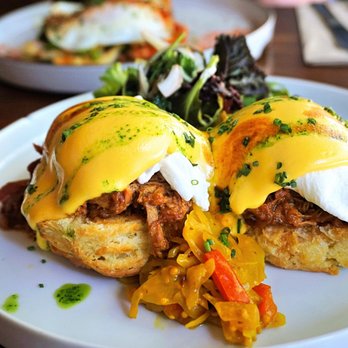 Catch 122 - Smoked Pork Shoulder Benny: buttermilk biscuit, poached eggs, salsa verde, chow chow, cilantro, greens, hollandaise, bbq sauce ($16). - Breakfast & Brunch Near Me - North Vancouver, British Columbia Catch 122 - Smoked Pork Shoulder Benny: buttermilk biscuit, poached eggs, salsa verde, chow chow, cilantro, greens, hollandaise, bbq sauce ($16). - Breakfast & Brunch Near Me - North Vancouver, British Columbia