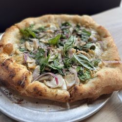 Artisan Wood Fired Kitchen - Pizza with arugula, chicken, mushroom, onion
