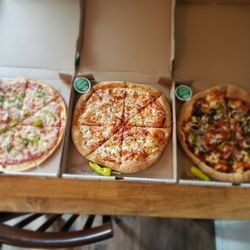 Papa Johns Pizza - 3 large  l  - r: Thin crust onion & green pepper; reg crust add onion; reg crust , onion, green pepper, pineapple, mushrms & black olives.