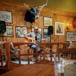 The Steak Out - Dining room live entertainment.  Perfect sound level, plus he plays both kinds of music: country and western. Talented young guy.