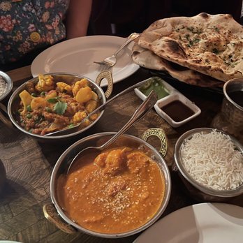 Annapurna Cafe - Shrimp Korma in front. With garlic naan. - Indian Near Me - Seattle, Washington Annapurna Cafe - Shrimp Korma in front. With garlic naan. - Indian Near Me - Seattle, Washington