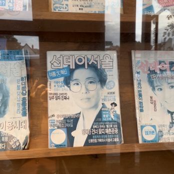 Jongro BBQ Flushing - Outdoor displayed old magazines - Korean Near Me - Flushing, New York