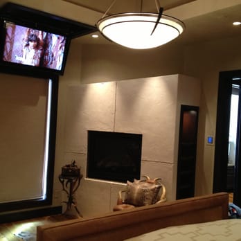 Performance Electronics Built by Design - For a cleaner look hide your T.V in the ceiling with a motorized lift! - Home Theatre Installation Near Me Performance Electronics Built by Design - For a cleaner look hide your T.V in the ceiling with a motorized lift! - Home Theatre Installation Near Me