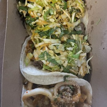 Kogi BBQ - 2 short rib tacos and 1 Calamari Taco - Mexican Near Me - Los Angeles, California Kogi BBQ - 2 short rib tacos and 1 Calamari Taco - Mexican Near Me - Los Angeles, California