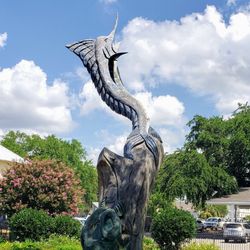 Biloxi Town Green - A carving from destroyed tree.