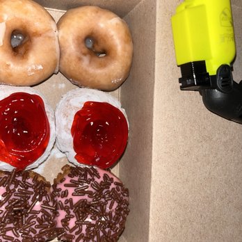 Mini Donut Diva - 6 Pack of Minis (Glazed and Confused, Donut Be Jelly, and Strawberry Frosted) mini torch lighter for scaling lol - A box contains six donuts with various toppings: glazed, jelly, and chocolate sprinkles, placed on a brown surface. - Donuts Near Me - Boston, Massachusetts