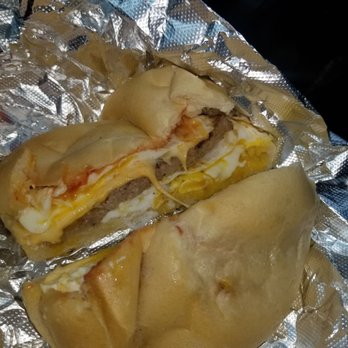 Bagels & Beyond - Sausage, egg (over easy), cheese, ketchup, pepper on a scooped and toasted (even though it was barley toasted) "kaiser roll" - Delis Near Me - Brooksville, Florida Bagels & Beyond - Sausage, egg (over easy), cheese, ketchup, pepper on a scooped and toasted (even though it was barley toasted) "kaiser roll" - Delis Near Me - Brooksville, Florida