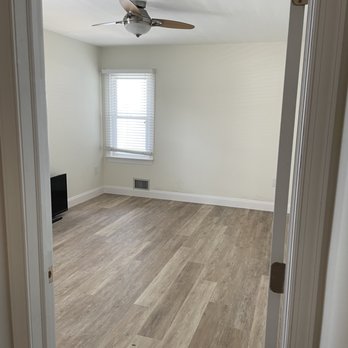 Robust Renovations - an empty room with a ceiling fan - Flooring Near Me Robust Renovations - an empty room with a ceiling fan - Flooring Near Me