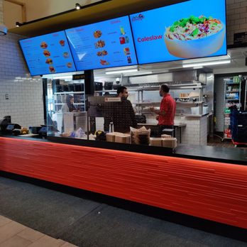 Chicken G's - a restaurant counter with a large screen - Halal Near Me - San Francisco, California Chicken G's - a restaurant counter with a large screen - Halal Near Me - San Francisco, California