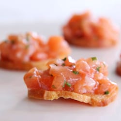 Seasoned Catering and Events - Salmon tartare on crostini, zest of lemon, creme fraiche